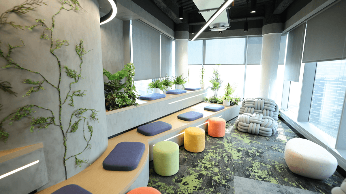 Team collaborating around a laptop